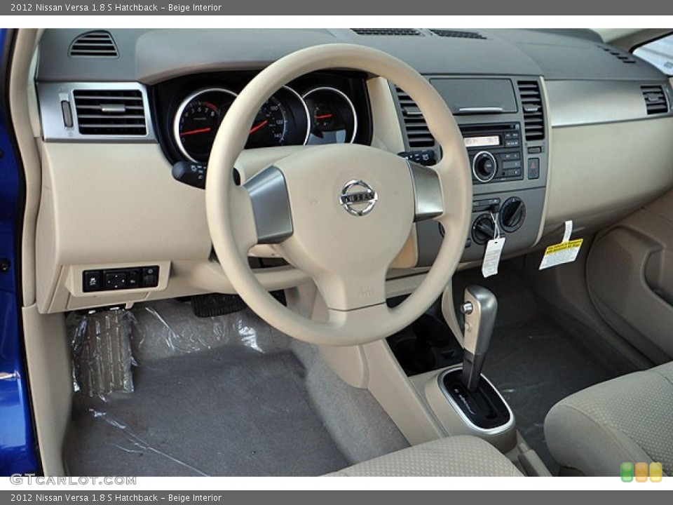 Beige Interior Dashboard for the 2012 Nissan Versa 1.8 S Hatchback #72354326