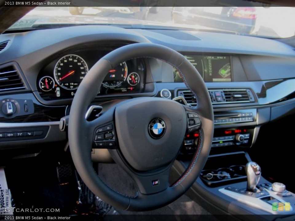 Black Interior Dashboard for the 2013 BMW M5 Sedan #72359016