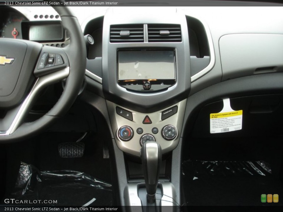 Jet Black/Dark Titanium Interior Controls for the 2013 Chevrolet Sonic LTZ Sedan #72659254