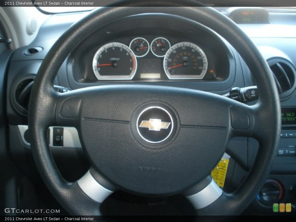 Charcoal Interior Steering Wheel for the 2011 Chevrolet Aveo LT Sedan #72729281