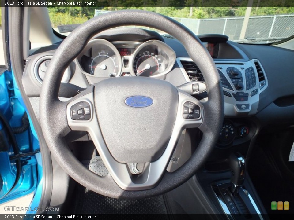 Charcoal Black Interior Steering Wheel for the 2013 Ford Fiesta SE Sedan #73022458