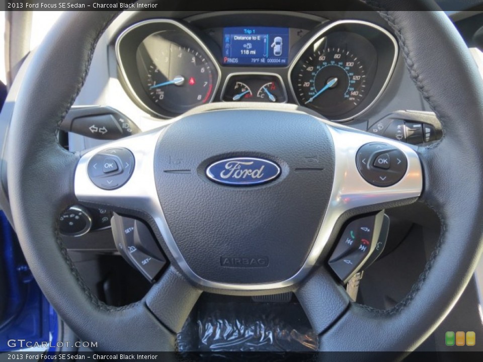 Charcoal Black Interior Steering Wheel for the 2013 Ford Focus SE Sedan #73030865