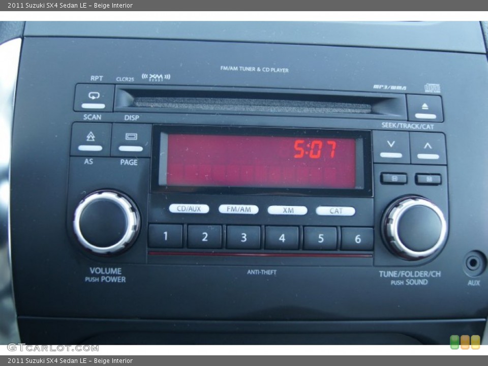 Beige Interior Audio System for the 2011 Suzuki SX4 Sedan LE #73476468