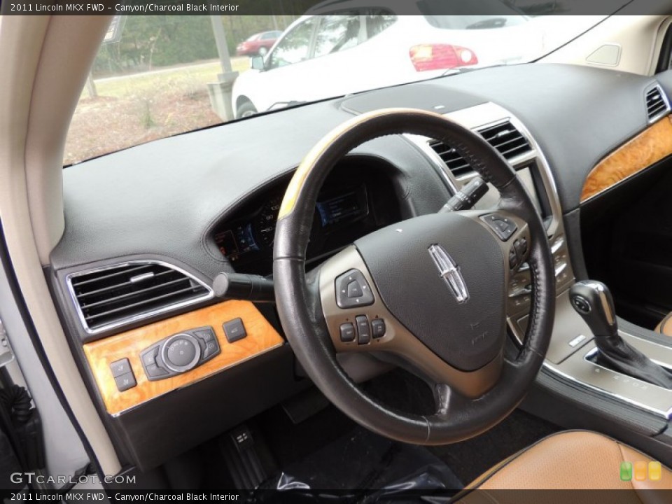 Canyon/Charcoal Black Interior Steering Wheel for the 2011 Lincoln MKX FWD #73495394