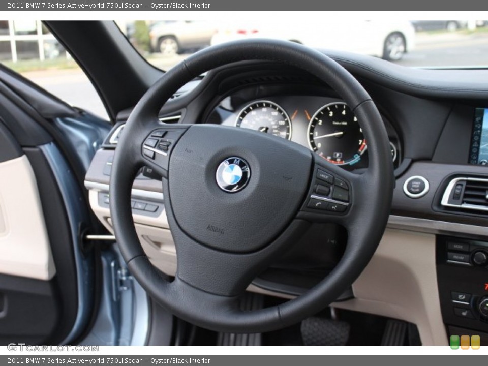Oyster/Black Interior Steering Wheel for the 2011 BMW 7 Series ActiveHybrid 750Li Sedan #73624092