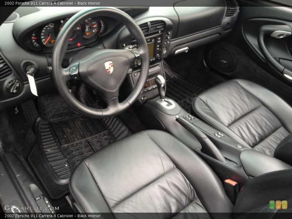 Black Interior Prime Interior for the 2002 Porsche 911 Carrera 4 Cabriolet #73643908