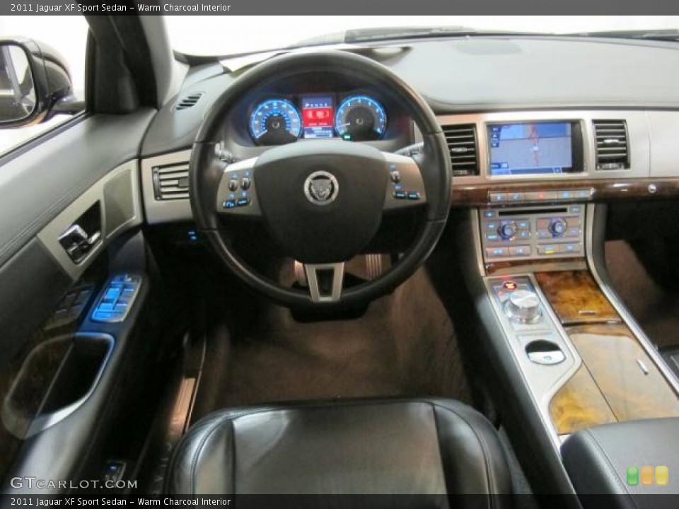 Warm Charcoal Interior Dashboard for the 2011 Jaguar XF Sport Sedan #73764399