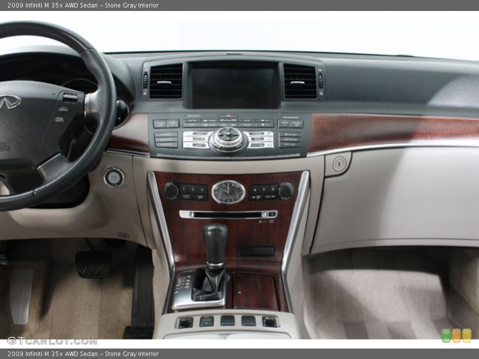 Stone Gray Interior Controls for the 2009 Infiniti M 35x AWD Sedan #73883504