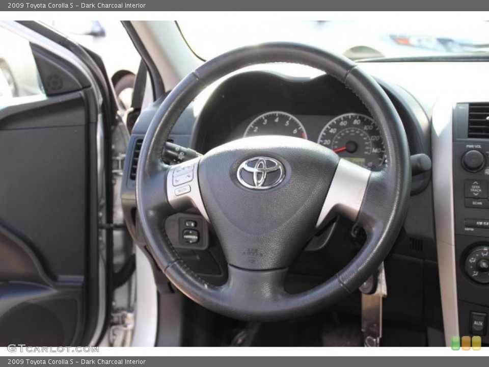 Dark Charcoal Interior Steering Wheel for the 2009 Toyota Corolla S #74080285