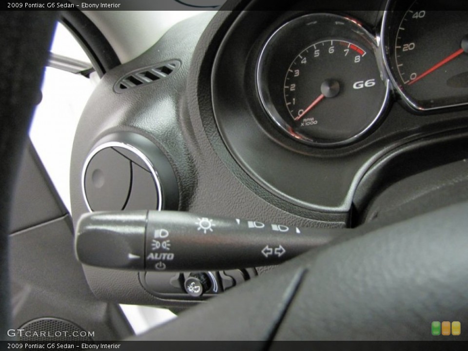 Ebony Interior Controls for the 2009 Pontiac G6 Sedan #74440049