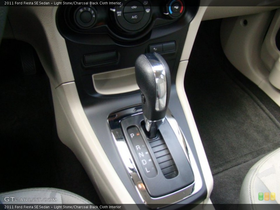 Light Stone/Charcoal Black Cloth Interior Transmission for the 2011 Ford Fiesta SE Sedan #74444978