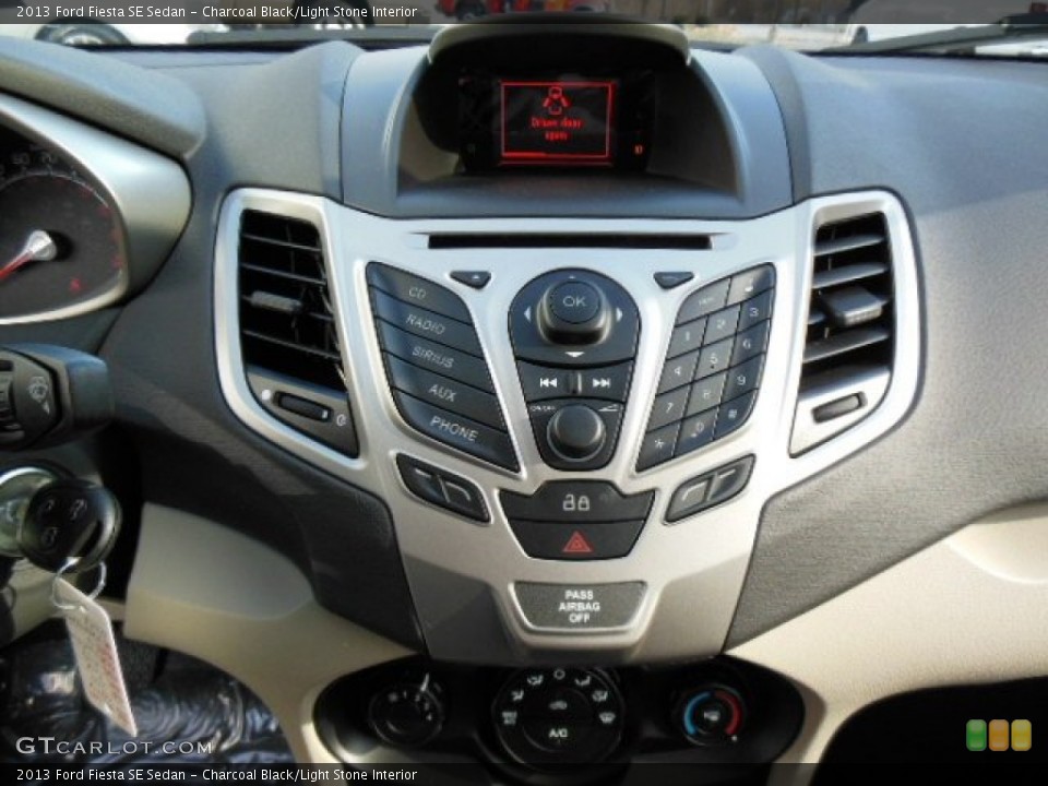 Charcoal Black/Light Stone Interior Controls for the 2013 Ford Fiesta SE Sedan #74487854