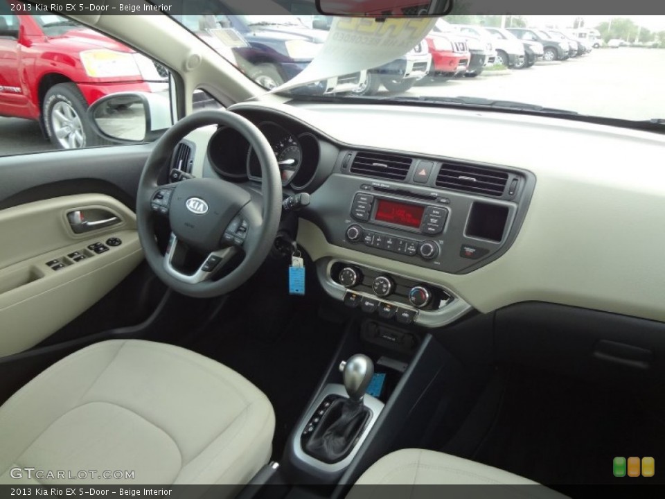 Beige Interior Dashboard for the 2013 Kia Rio EX 5-Door #74626518