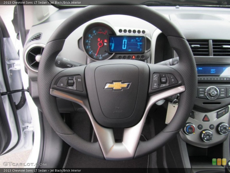 Jet Black/Brick Interior Steering Wheel for the 2013 Chevrolet Sonic LT Sedan #74635980
