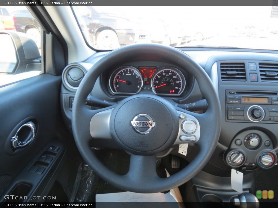 Charcoal Interior Steering Wheel for the 2013 Nissan Versa 1.6 SV Sedan #74740647