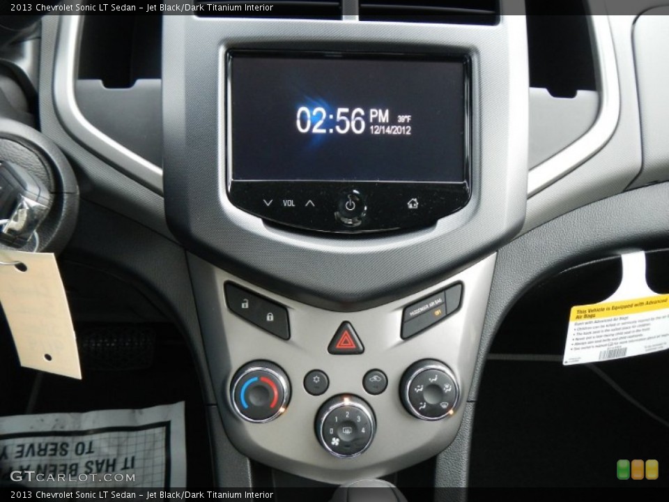 Jet Black/Dark Titanium Interior Controls for the 2013 Chevrolet Sonic LT Sedan #74890128