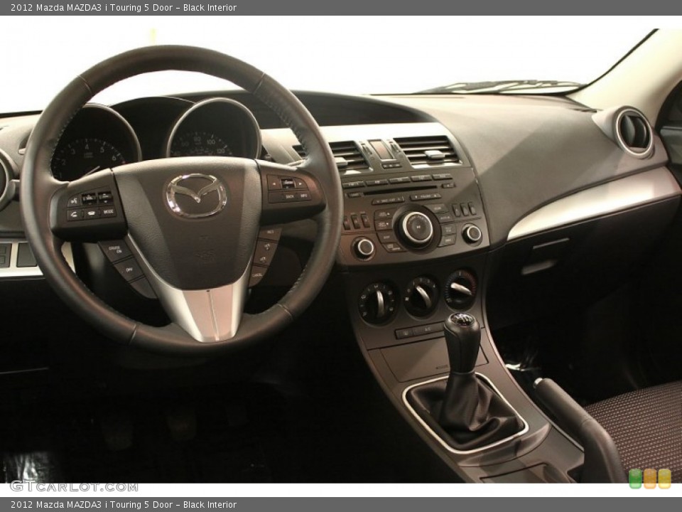Black Interior Dashboard for the 2012 Mazda MAZDA3 i Touring 5 Door #74923197