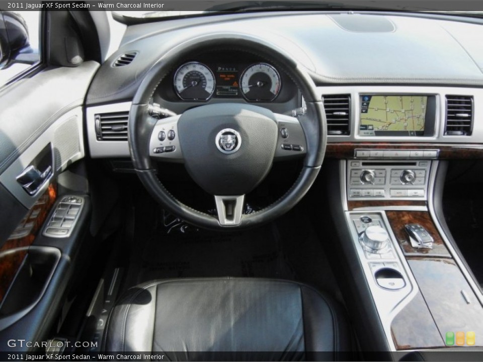 Warm Charcoal Interior Dashboard for the 2011 Jaguar XF Sport Sedan #75068401