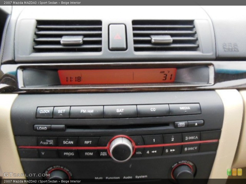 Beige Interior Audio System for the 2007 Mazda MAZDA3 i Sport Sedan #75240703