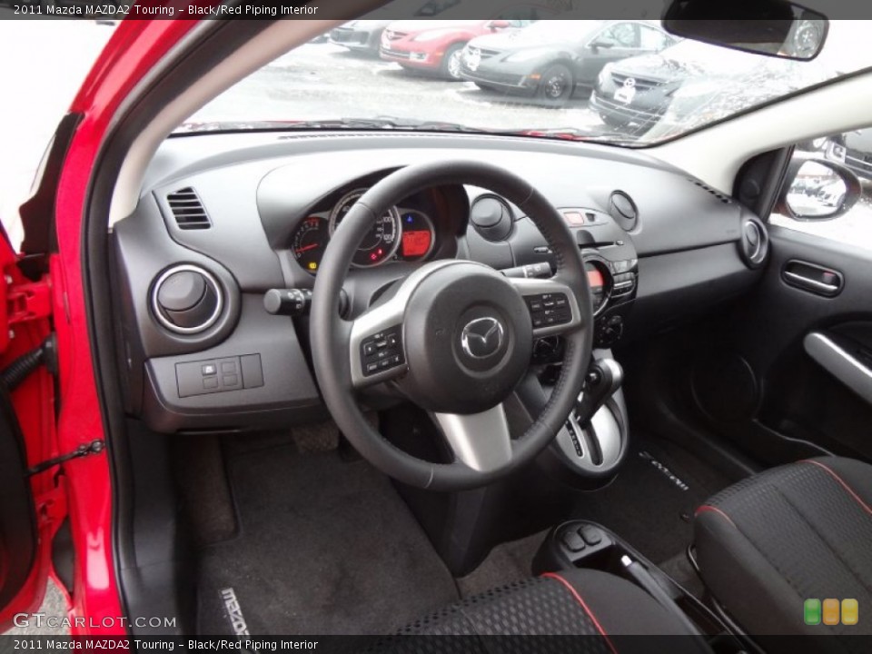 Black/Red Piping Interior Photo for the 2011 Mazda MAZDA2 Touring #75284427