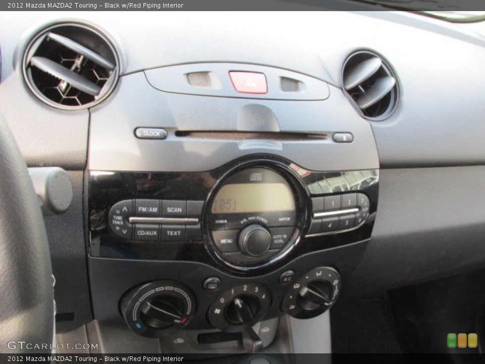 Black w/Red Piping Interior Controls for the 2012 Mazda MAZDA2 Touring #75374363
