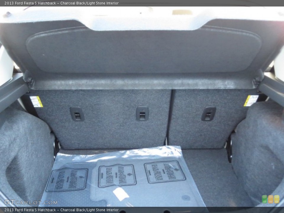 Charcoal Black/Light Stone Interior Trunk for the 2013 Ford Fiesta S Hatchback #75444085