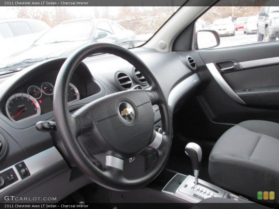 Charcoal Interior Steering Wheel for the 2011 Chevrolet Aveo LT Sedan #75459600