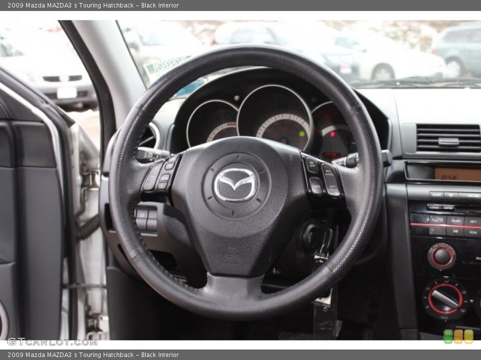 Black Interior Steering Wheel for the 2009 Mazda MAZDA3 s Touring Hatchback #75545709