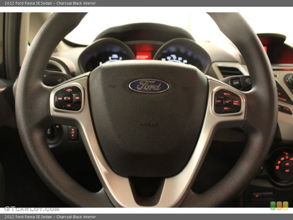 Charcoal Black Interior Steering Wheel for the 2012 Ford Fiesta SE Sedan #75763208