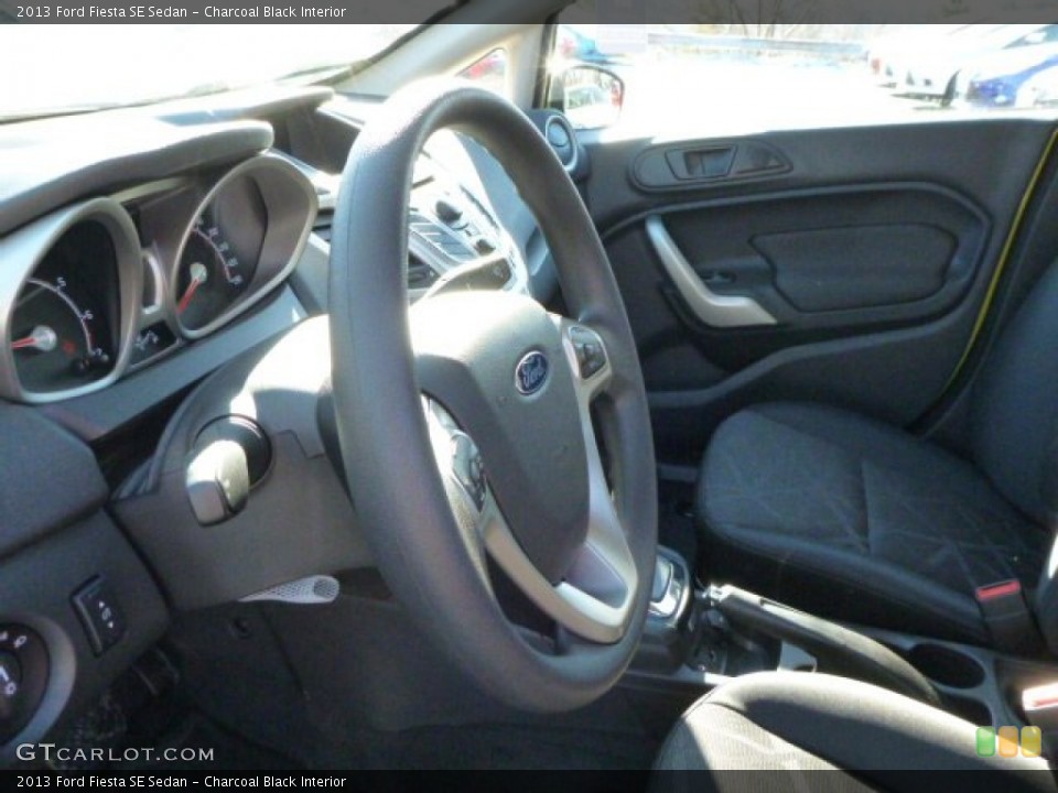 Charcoal Black Interior Steering Wheel for the 2013 Ford Fiesta SE Sedan #76084700