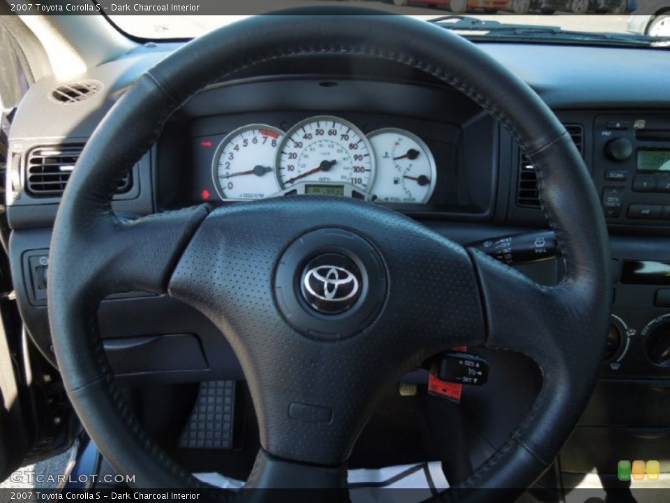 Dark Charcoal Interior Steering Wheel for the 2007 Toyota Corolla S #76112931
