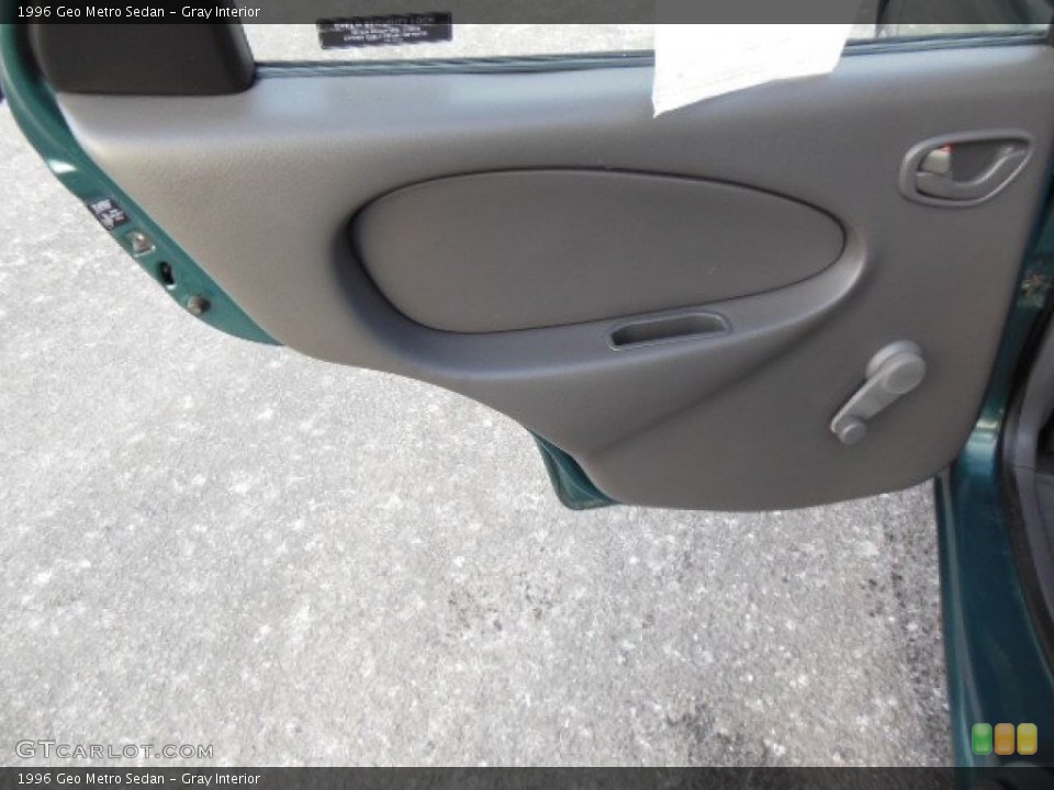 Gray Interior Door Panel for the 1996 Geo Metro Sedan #76292441
