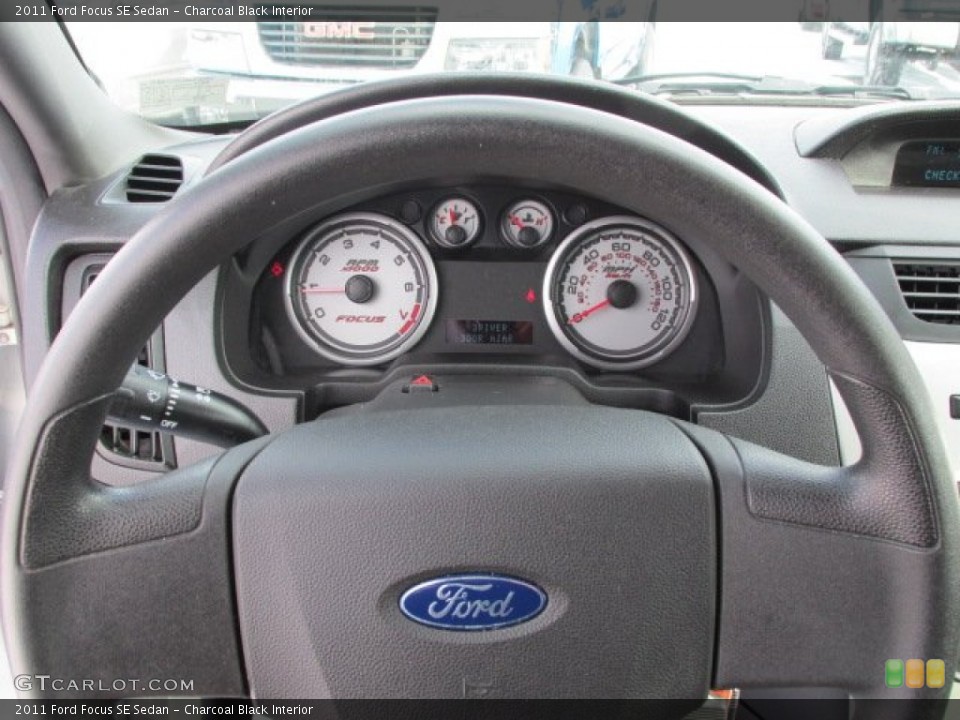 Charcoal Black Interior Steering Wheel for the 2011 Ford Focus SE Sedan #76350206