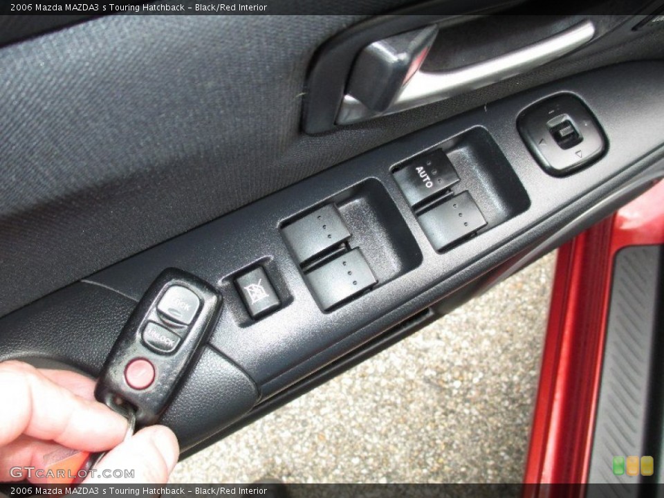 Black/Red Interior Controls for the 2006 Mazda MAZDA3 s Touring Hatchback #76599685