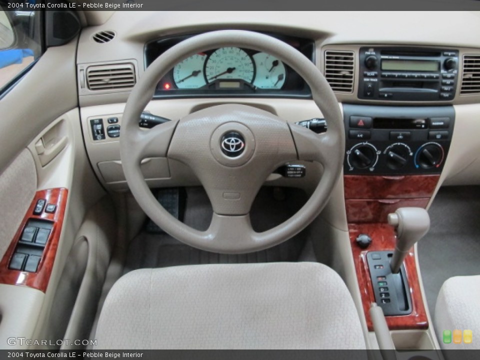 Pebble Beige Interior Dashboard for the 2004 Toyota Corolla LE #76629658