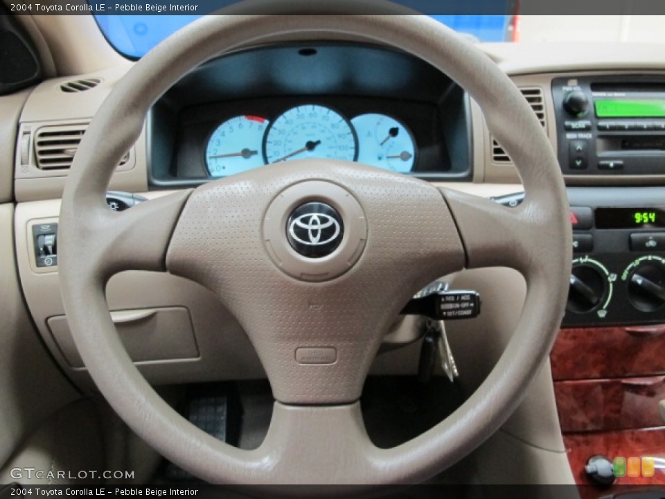 Pebble Beige Interior Steering Wheel for the 2004 Toyota Corolla LE #76629837