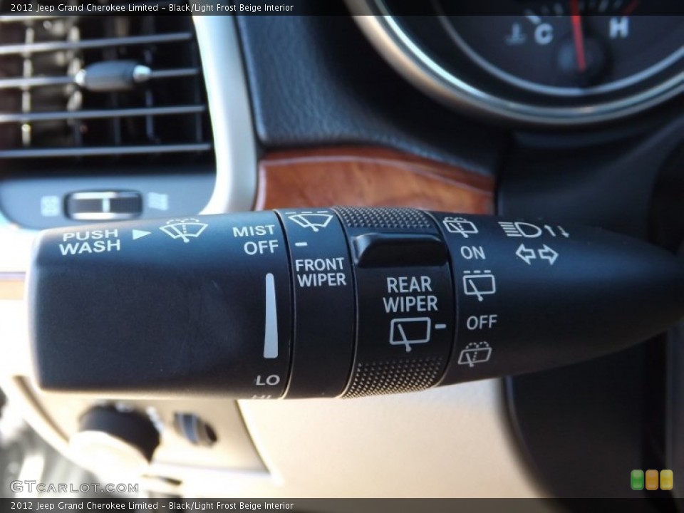 Black/Light Frost Beige Interior Controls for the 2012 Jeep Grand Cherokee Limited #76661139