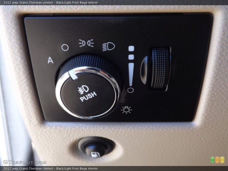 Black/Light Frost Beige Interior Controls for the 2012 Jeep Grand Cherokee Limited #76661166