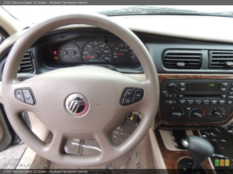 Medium Parchment Interior Steering Wheel for the 2002 Mercury Sable GS Sedan #76664033