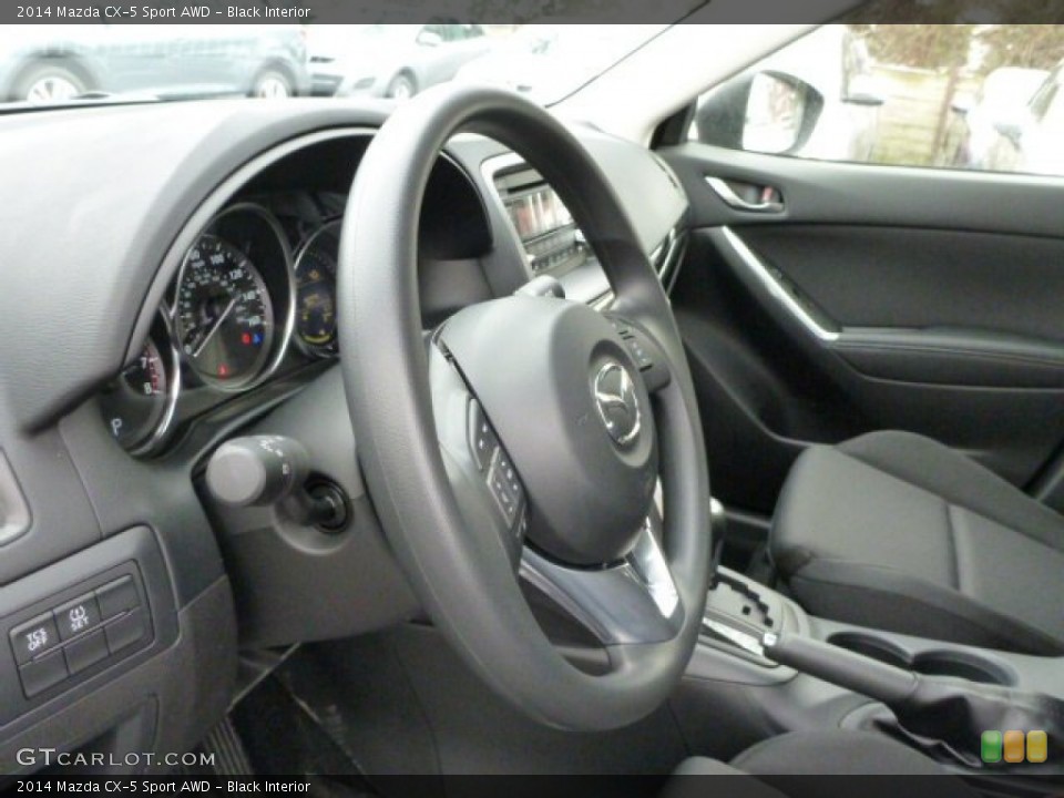 Black Interior Steering Wheel for the 2014 Mazda CX-5 Sport AWD #76733407