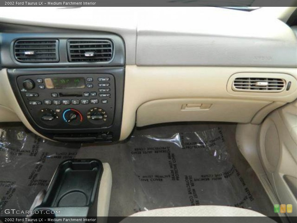 Medium Parchment Interior Dashboard for the 2002 Ford Taurus LX #76752621