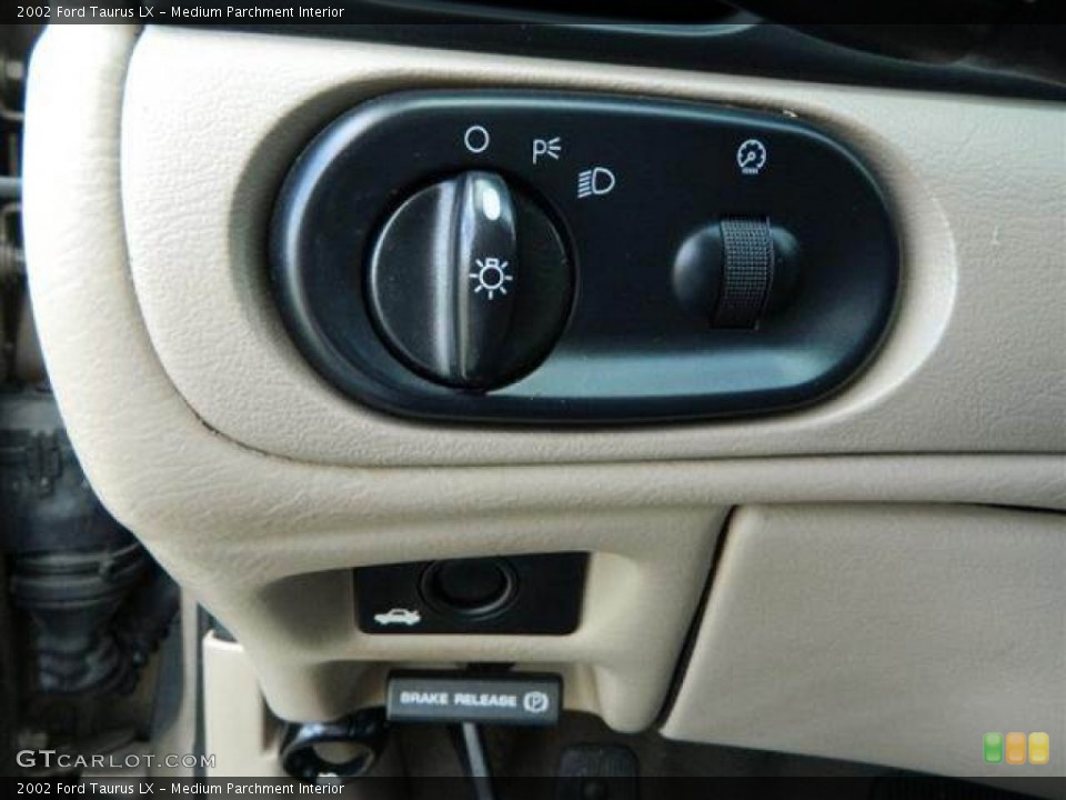 Medium Parchment Interior Controls for the 2002 Ford Taurus LX #76752848