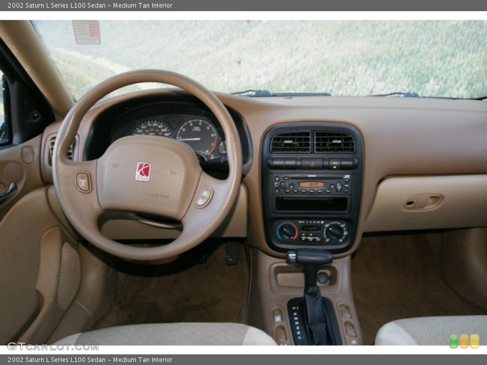 Medium Tan Interior Dashboard for the 2002 Saturn L Series L100 Sedan #76763126