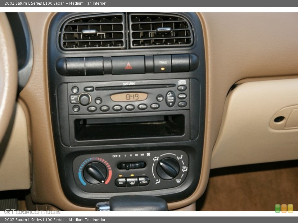Medium Tan Interior Controls for the 2002 Saturn L Series L100 Sedan #76763156
