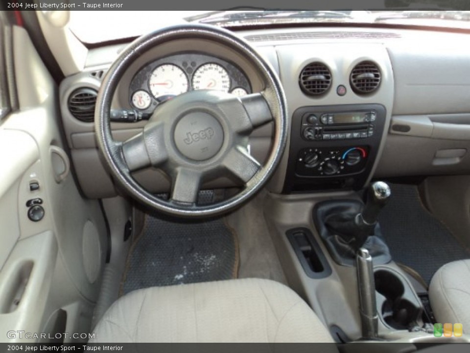 Taupe Interior Dashboard for the 2004 Jeep Liberty Sport #76863642