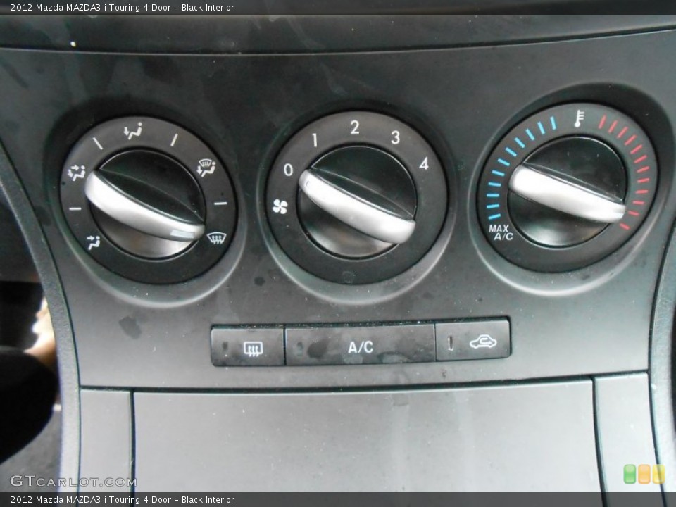 Black Interior Controls for the 2012 Mazda MAZDA3 i Touring 4 Door #77100118