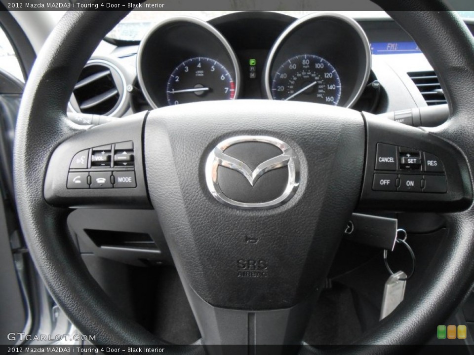 Black Interior Steering Wheel for the 2012 Mazda MAZDA3 i Touring 4 Door #77100152