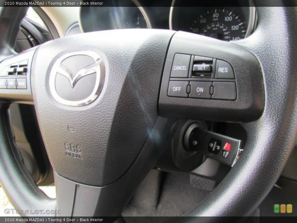 Black Interior Controls for the 2010 Mazda MAZDA3 i Touring 4 Door #77109813