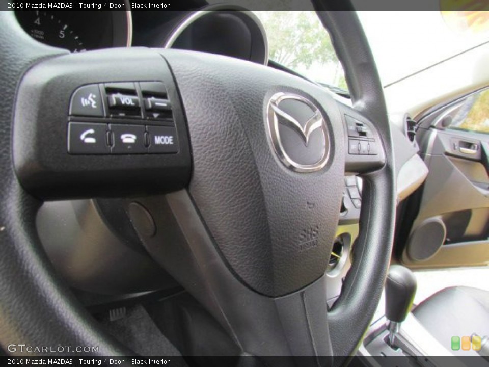 Black Interior Controls for the 2010 Mazda MAZDA3 i Touring 4 Door #77109839