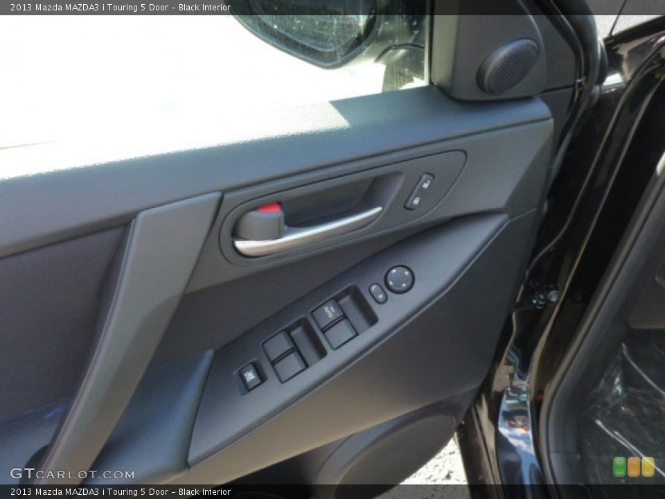Black Interior Controls for the 2013 Mazda MAZDA3 i Touring 5 Door #77142973